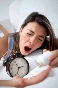 woman awake sleeping pills insomnia
