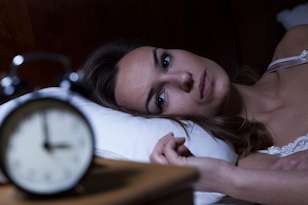 what is insomnia woman awake clock insomnia
