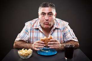 grain brain diet man eating burger