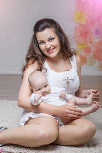 happy mom and baby at home